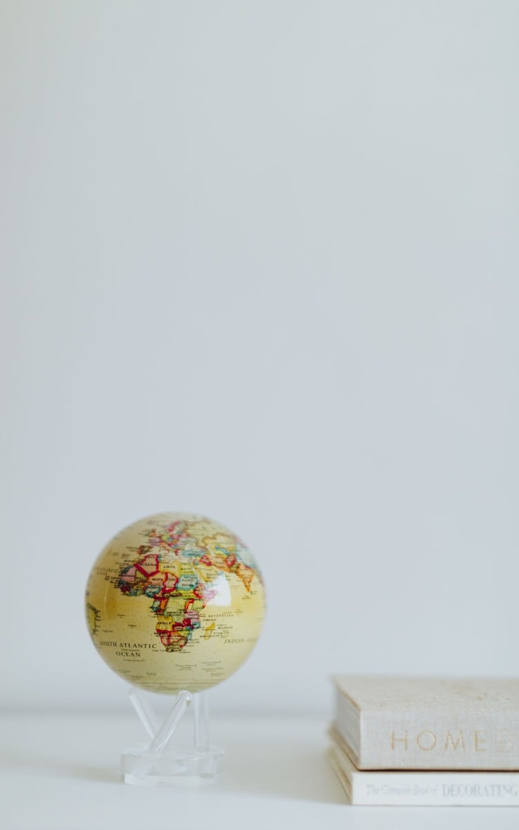 Yellow political map world globe with books